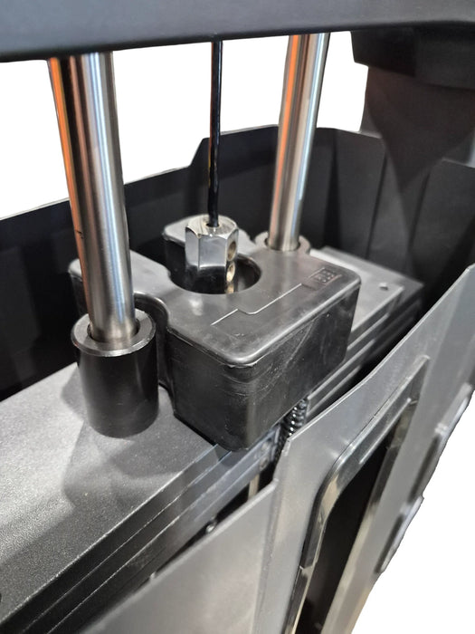 Demi-poids installé sur une machine à câbles
